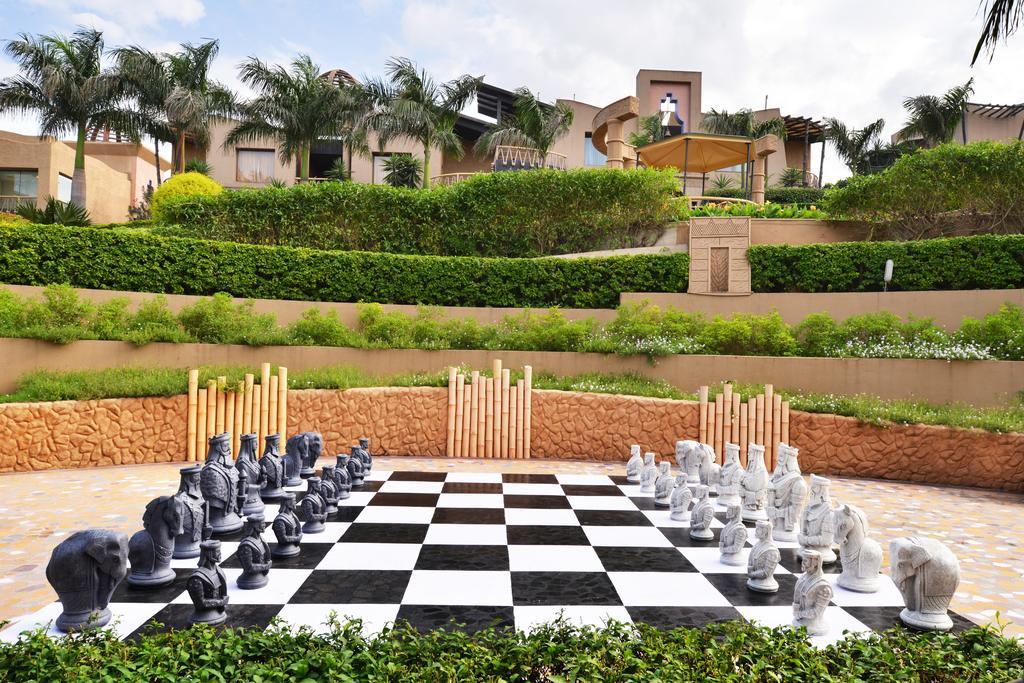 The Corinthians Resort And Club Pune Exteriör bild The resort's giant chess board
